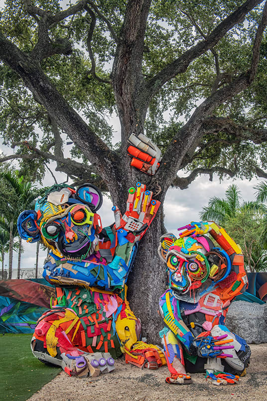 Two large colourful monkey sculptures.