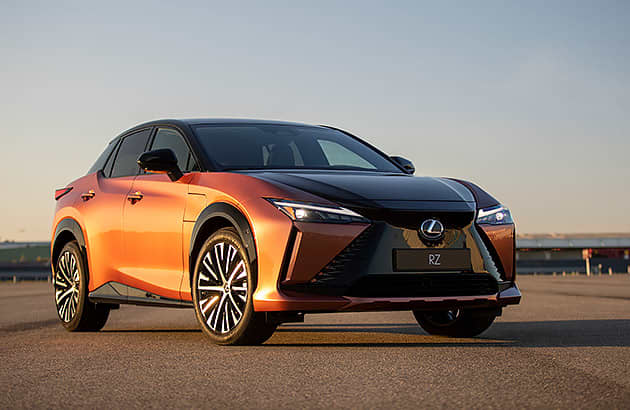 A light brown LEXUS RZ on a tarmac