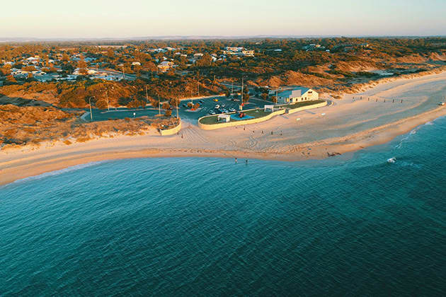 Long stretch of beach at sunset