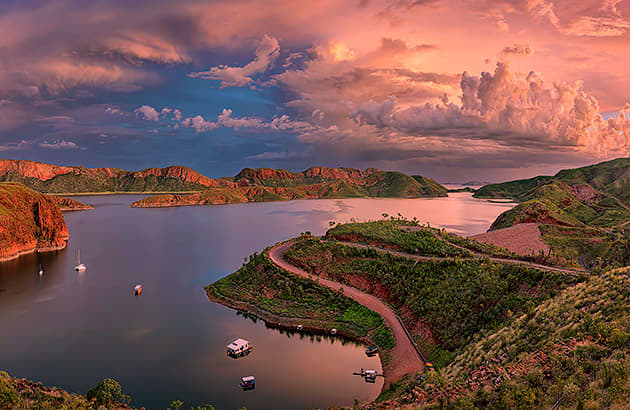 Aerial shot of Lake Argyle at sunset with boats in the water