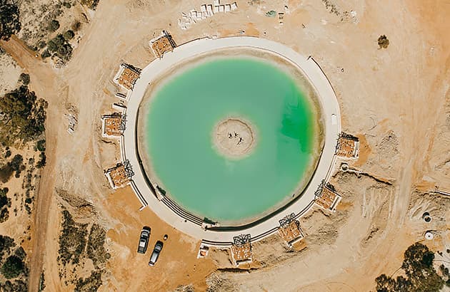 An aerial view of the green salt pool at Wave Rock Resort