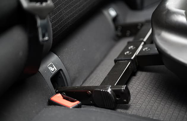 An ISOFIX seat being installed in a car