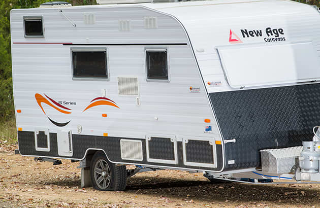 A caravan held up by a bottle jack