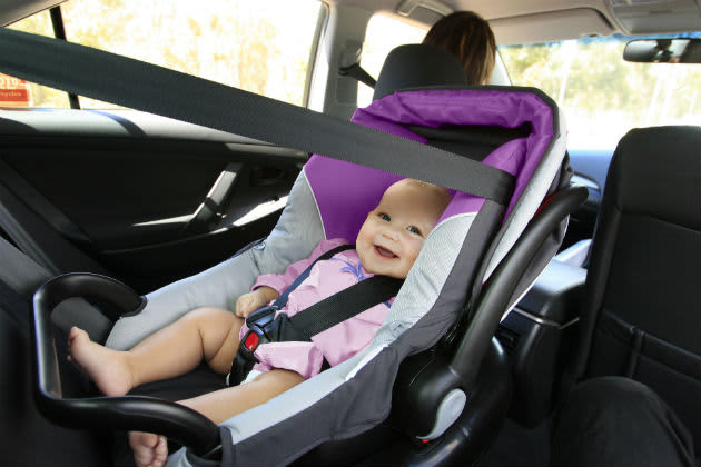 A baby in a child car restraint capsule