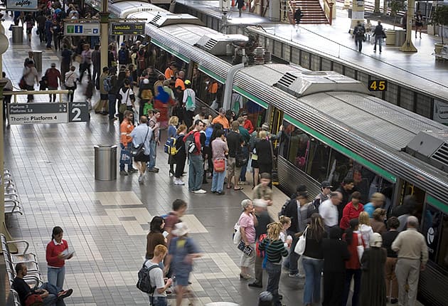 Commuters boarding a train at Perth station