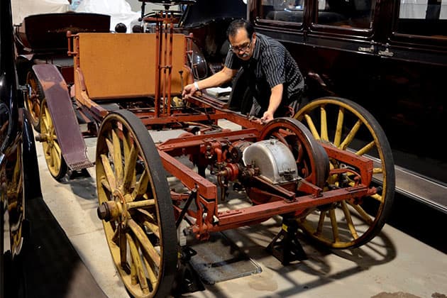 Western Australian Museum Technical Officer Salvador Gomez examining the car