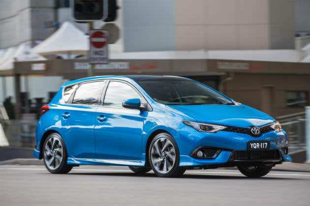 Side profile of a blue 2016 Toyota Corolla