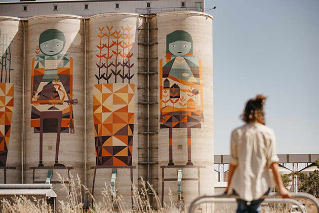 Woman looking at silos