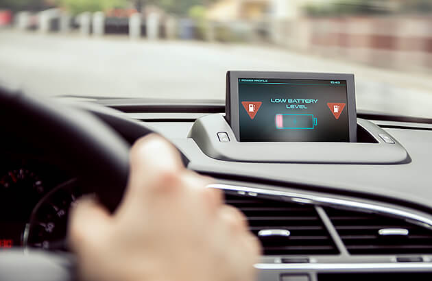 Dashboard display showing a low EV battery charge