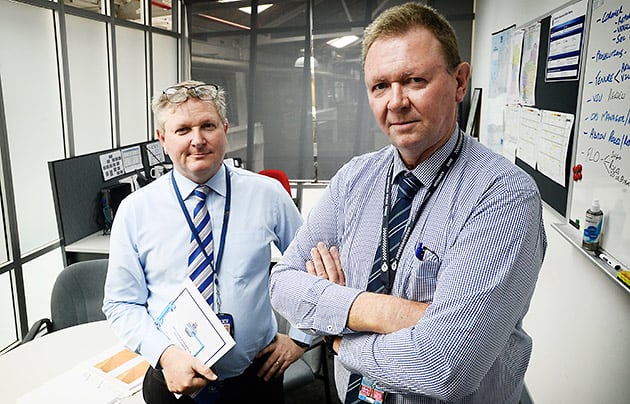 Travis Hagan and Mal Jones in the office of the major crash squad.