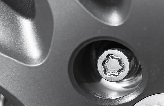 A locking wheel nut on a car tyre