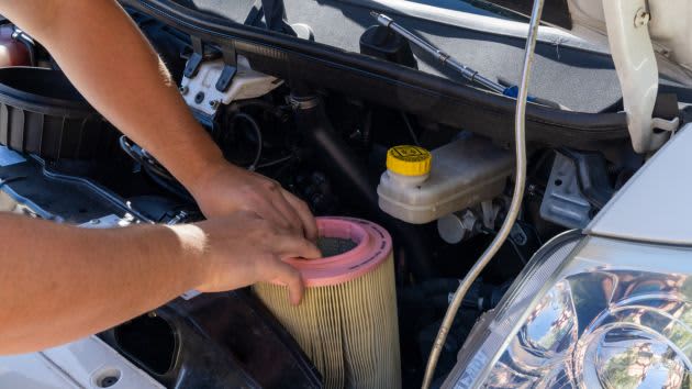 air filter being removed from car