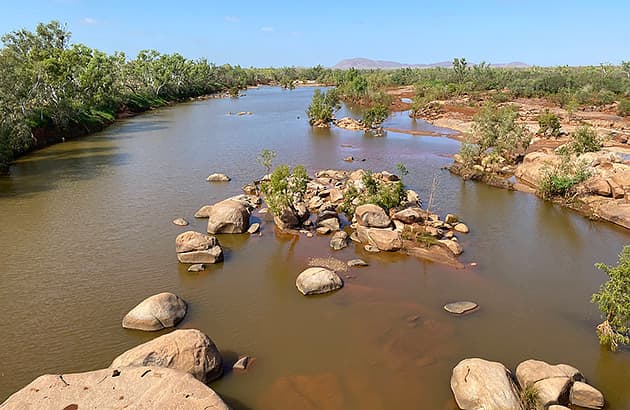 A view over the Ashburton River with boulders in the water