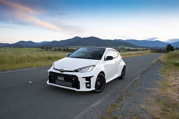 White car on country road