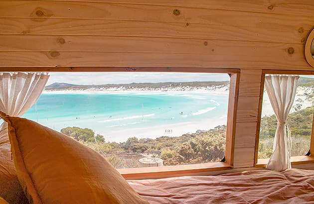 A view of beach from the window of a van