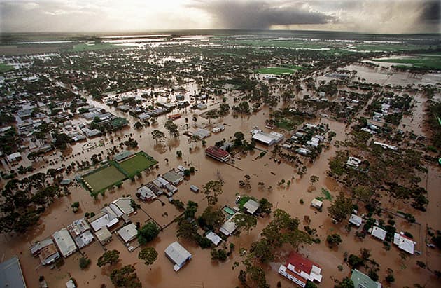 An arial view of lines of flooded homes.