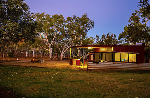 A covered barbeque area at night at Violet Valley campground