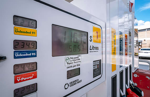 A close up of the fuel prices on a fuel bowser
