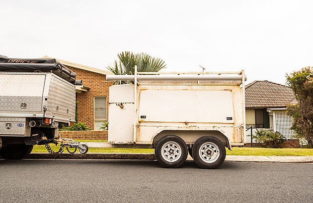 An old dual-axle box trailer