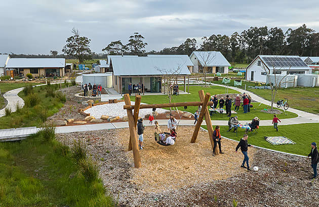 People and children gathered in a park