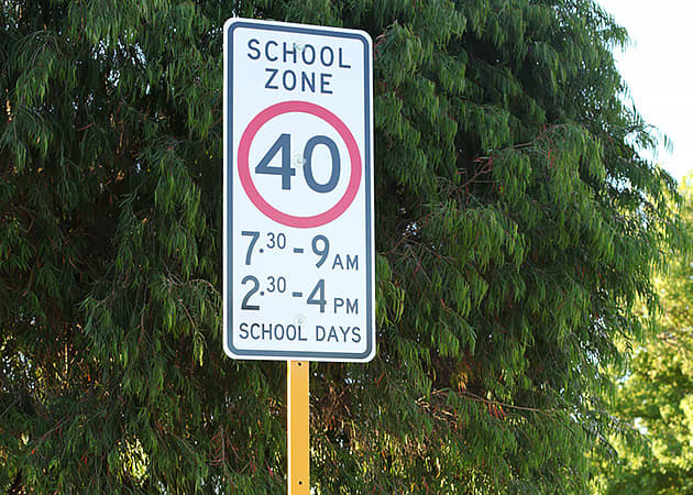 A school zone speed limit sign