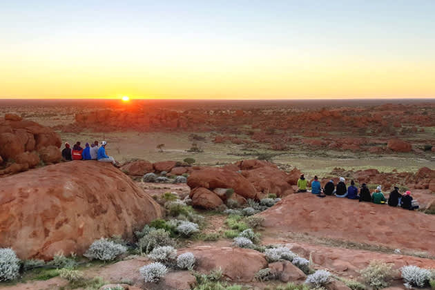 People are watching the sunset together at Wooleen Station