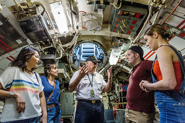 Tour guide inside submarine