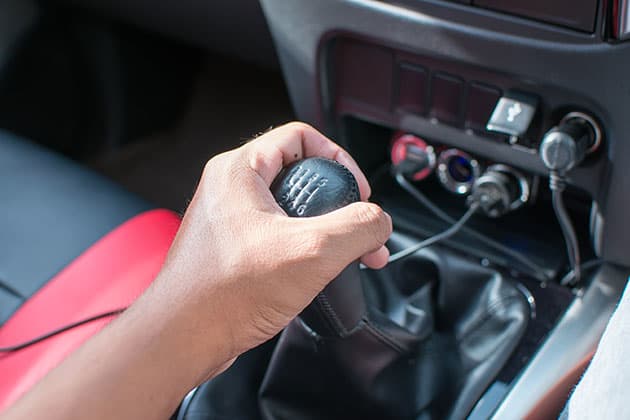 Hand on car gear stick