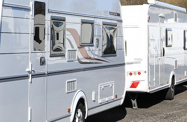 A close up of windows on a caravan viewed from outside