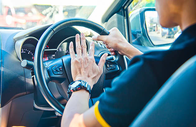 A driver using his car's horn to show his anger