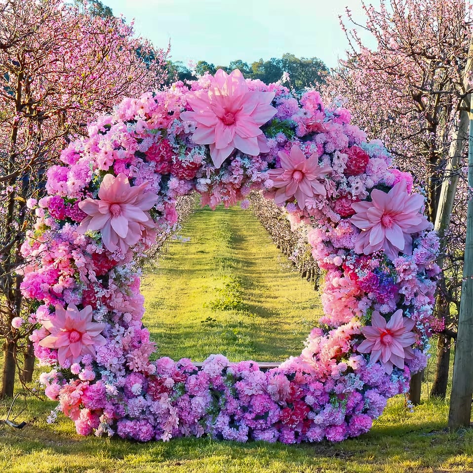 A photo backdrop wreath of flowers in orchard