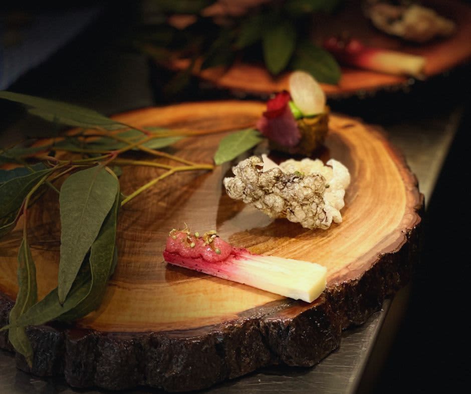 A wooden board plate with native Australian ingredients