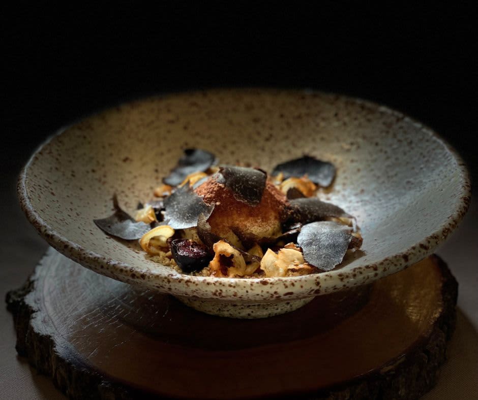 Flackyard signature dish in bowl with natie ingredients sitting atop a wooden board