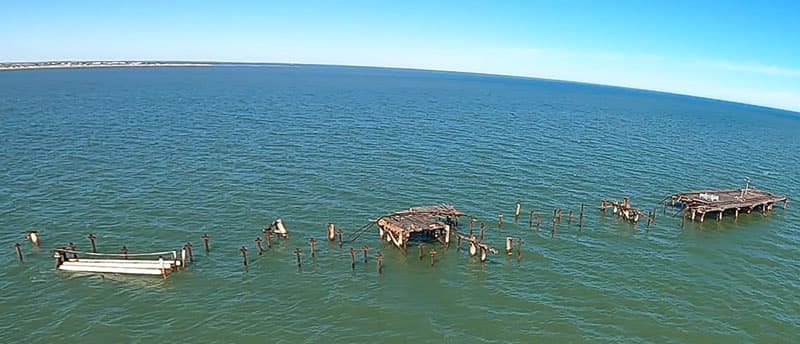 Remains of jetty in water.