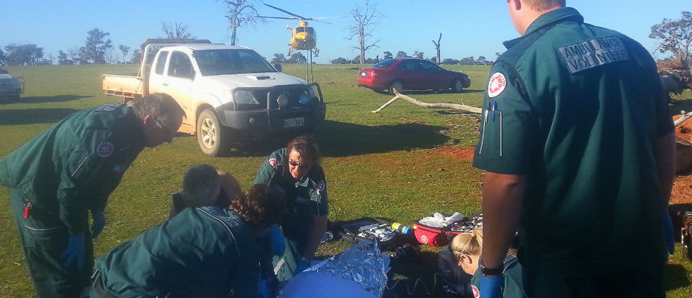 Kevin Gale being helped by paramedics