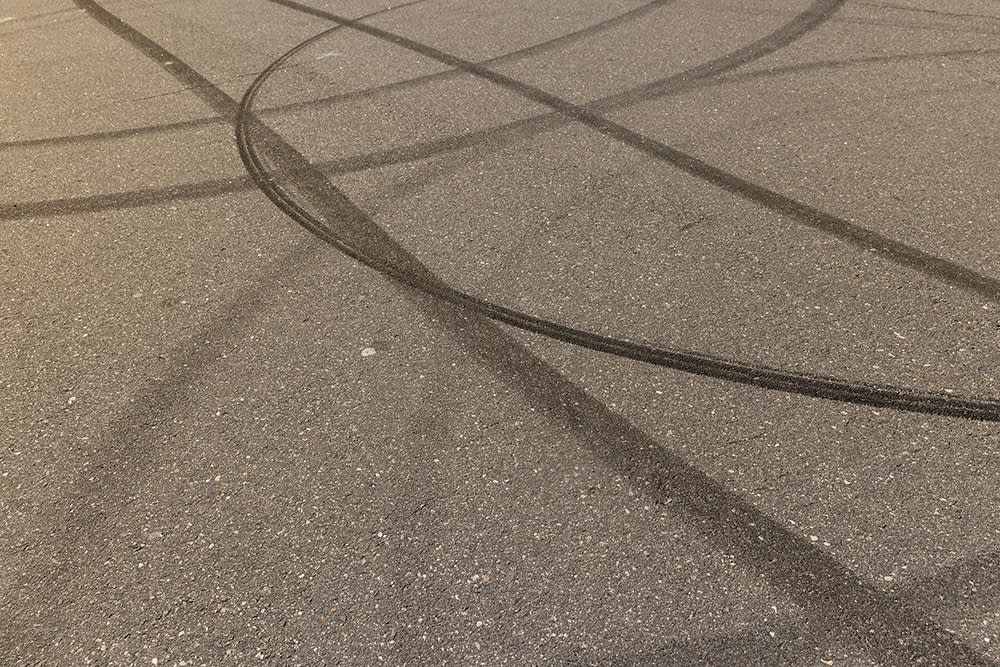 Multiple tyre skid marks on a road