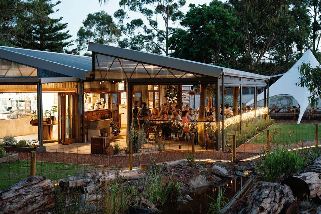 A view from outside The Good Paddock restaurant at night