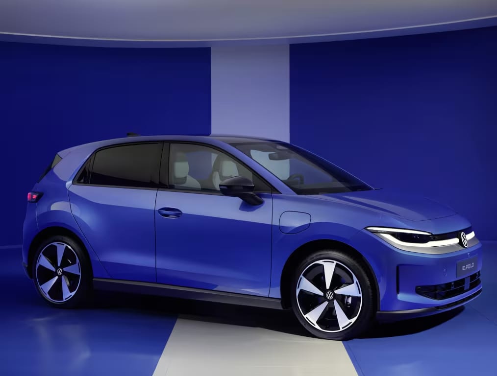 A blue Volkswagen id polo EV om a studio setting