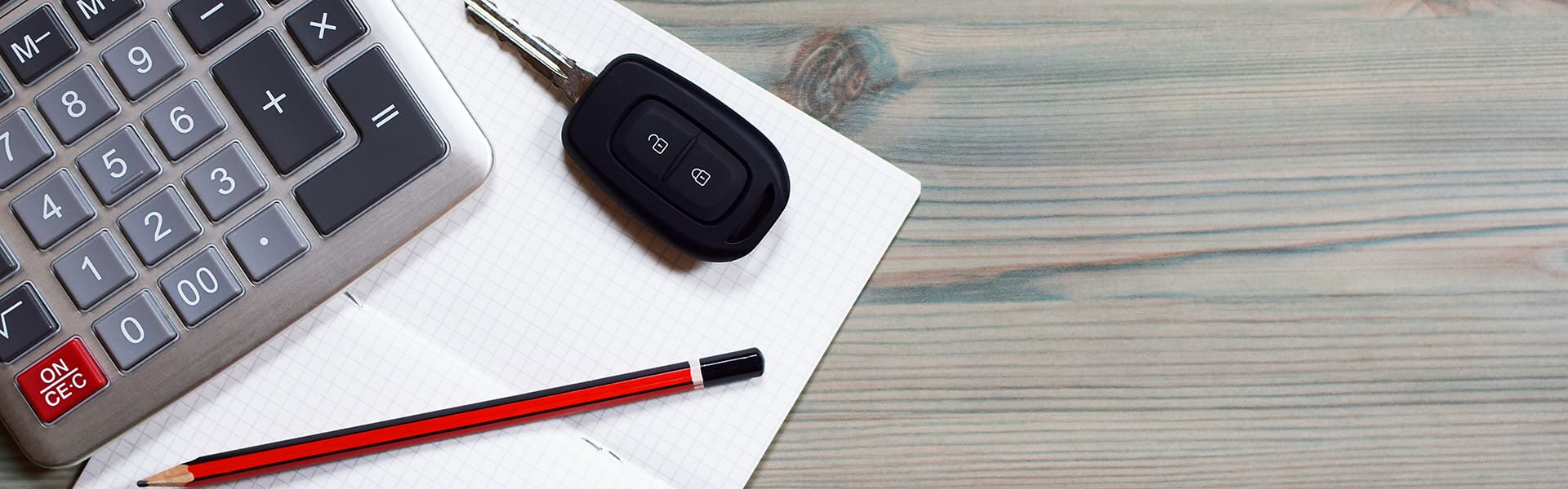 A calculator with car keys