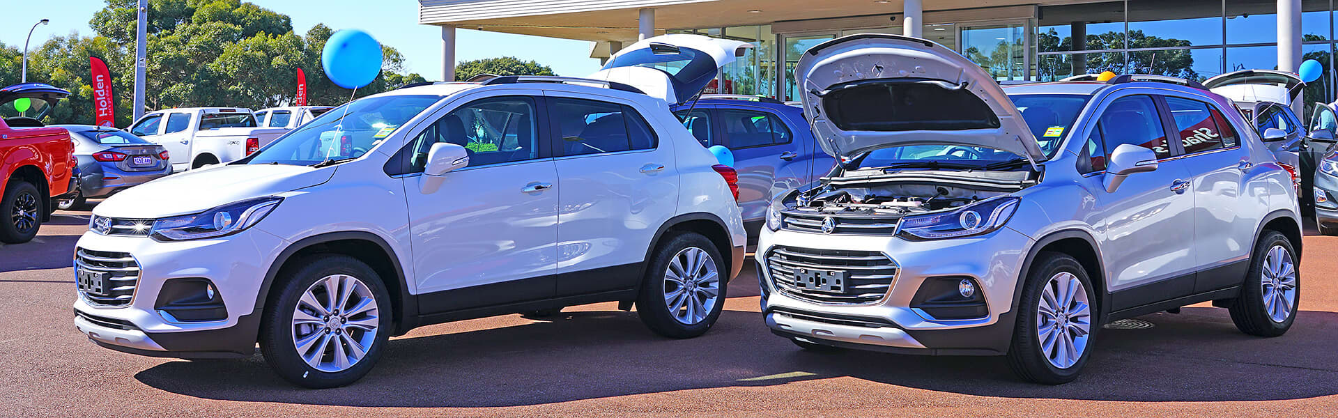 Two SUV's on display at a car yard