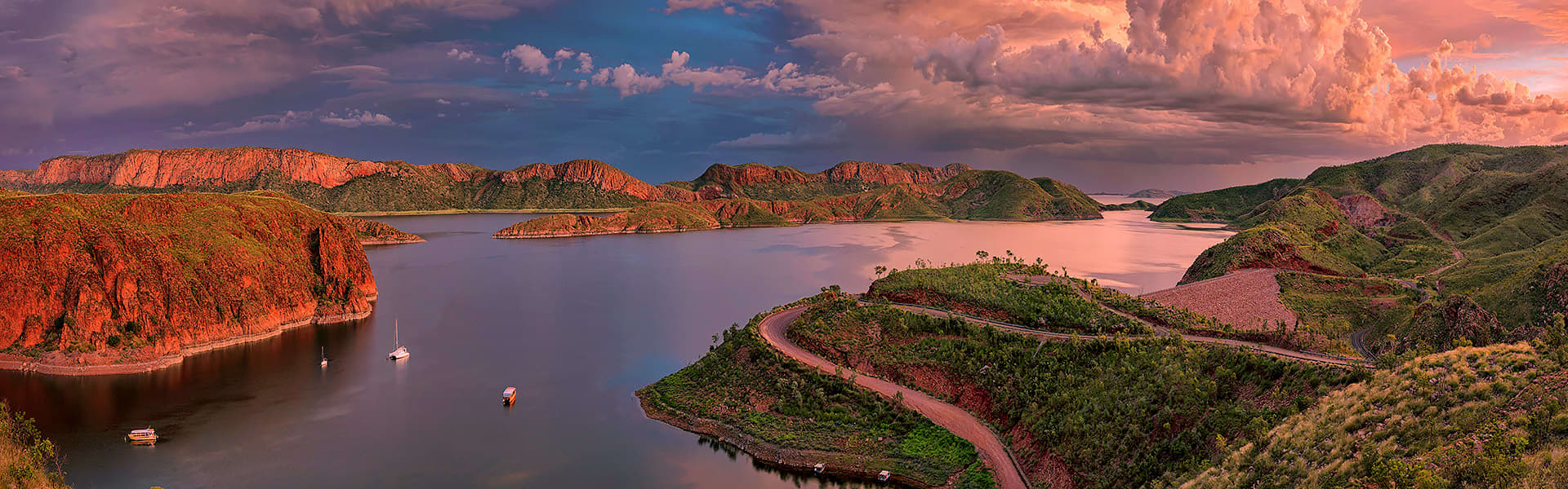Aerial shot of Lake Argyle at sunset with boats in the water