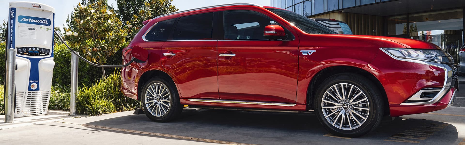 Red Mitsubishi Outlander hybrid car