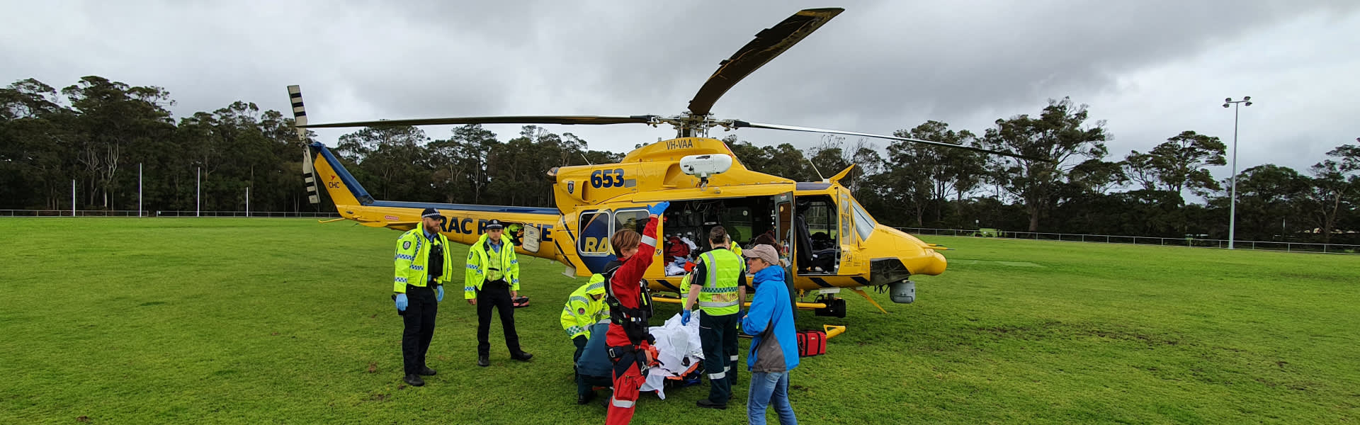 RAC Rescue helicopter landing on grass oval