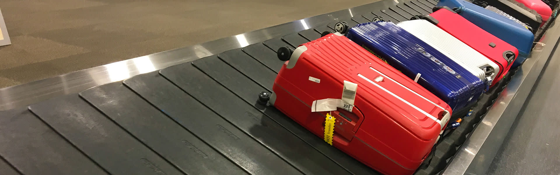 Luggage on a baggage claim conveyer belt