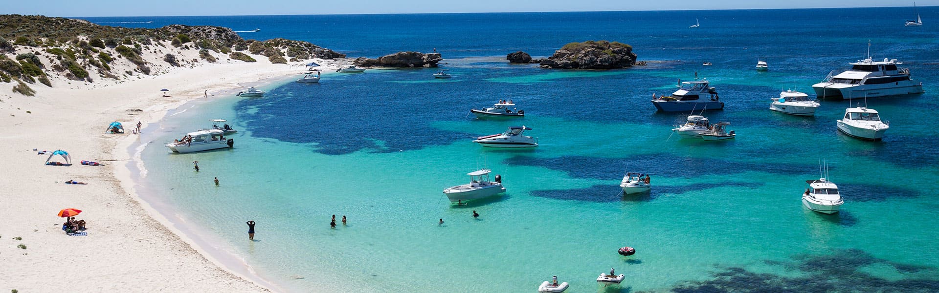 Boats on the water near the beach
