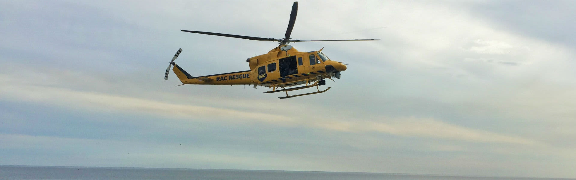 An RAC Rescue helicopter in the sky