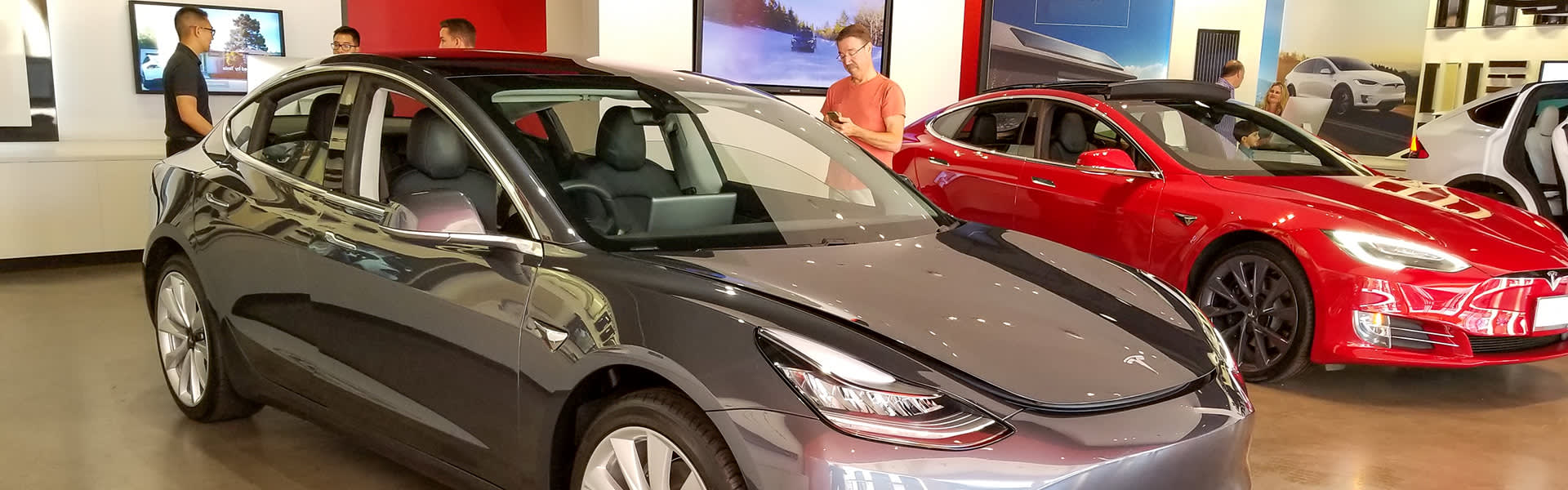 Tesla Model 3 cars in a showroom