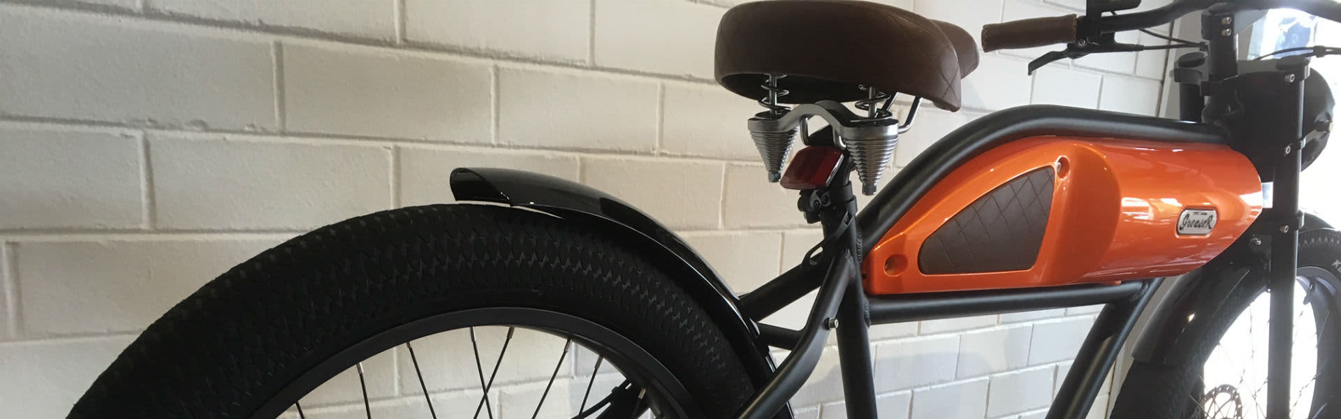 The striking orange model of the Greaser ebike