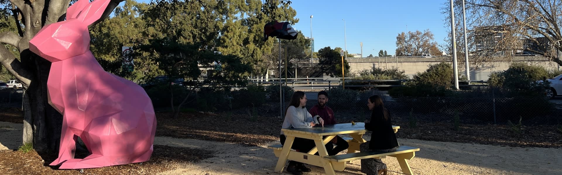 People sitting at park bench