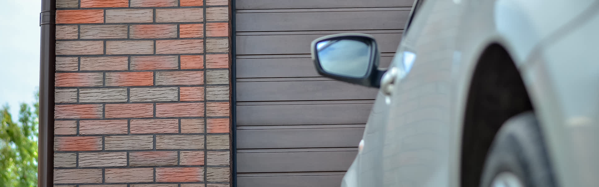 Image of car in front of garage